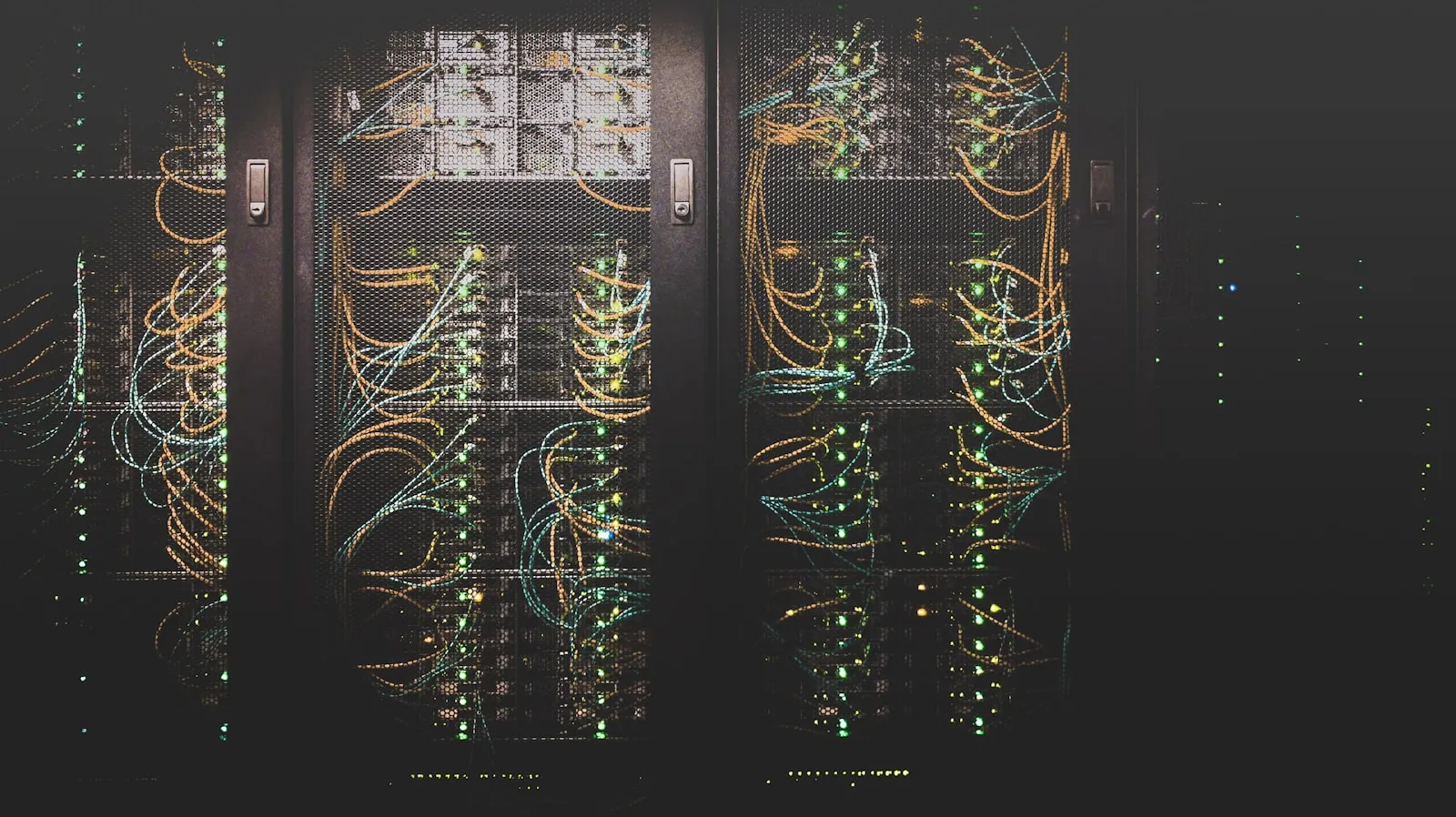 Rows of server racks and network cables in a data centre